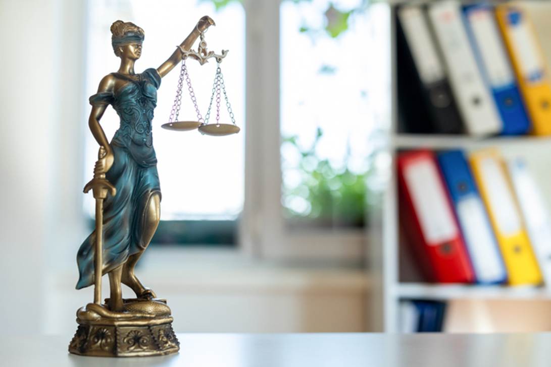 A statue of a person holding scales
AI-generated content may be incorrect.